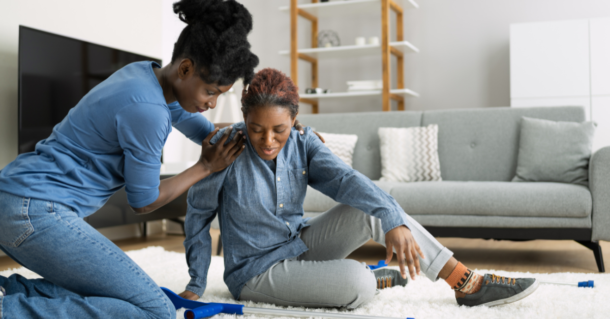 Photo of a woman falling due to an area rug in her home, sharing the importance of knowing your falls prevention risk and working wtih a physical therapy clinic to improve balance and strength.